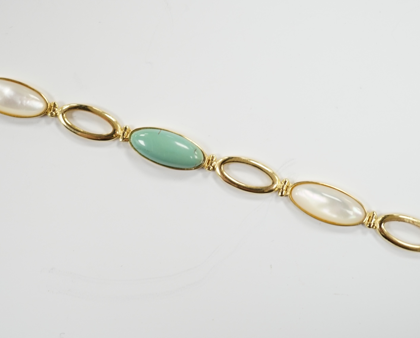 A modern 14k, mother of pearl and turquoise set bracelet, 18cm, gross weight 6.2 grams. moonstone and 14k bracelet